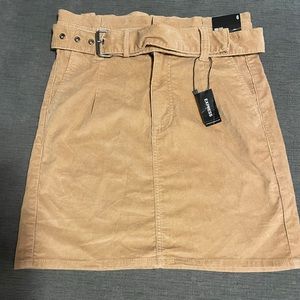 Express high-wasted belted corduroy skirt.